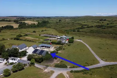 an aerial view of a house in a field at Stable Barn Apartment in Saint Breward