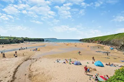 a group of people on a beach near the water at 4 Bed in St. Merryn oc-t29153 in St Merryn