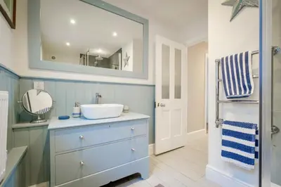 a bathroom with a sink and a mirror at 2 Bed in Downderry oc-p29018 in Downderry