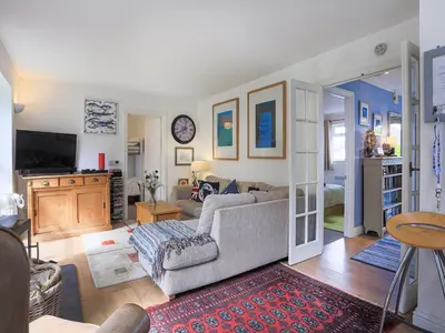 a living room with a couch and a tv at 31 Lower Elms in Saint Minver
