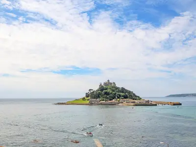 an island with a castle on it in the water at Little Wren Cottage in Marazion