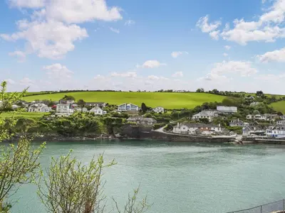 a view of a town with a river and houses at Corner Cottage - Uk47402 in Portmellon