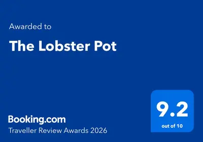 a blue box with the text upgraded to the lockerier pot at The Lobster Pot in Port Isaac