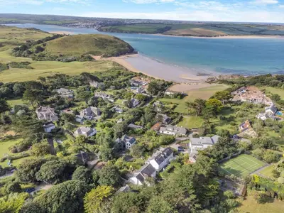 an aerial view of a home next to a beach at 5 Bed in Trebetherick oc-b29371 in Polzeath