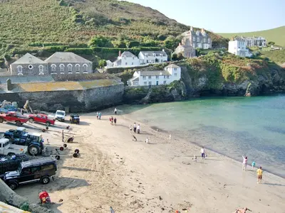 a group of people on a beach near the water at Rosewater Lodge in Saint Teath