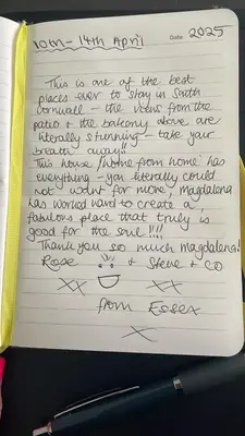 a letter written in handwriting on a piece of paper at Harber Rise House in Carlyon Bay