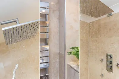 a bathroom with a shower with a glass door at Viridian in Carbis Bay