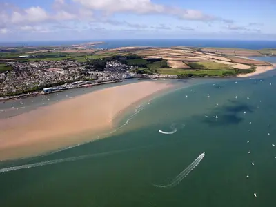 an aerial view of a beach with boats in the water at April Cottage in Padstow