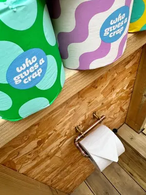 a roll of toilet paper on a drawer with a toilet paper holder at Lakeside Glamping Kingfisher in Saint Columb Major