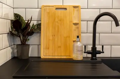 a bottle of soap sitting next to a kitchen sink at The Flat - Brand new renovation in amazing location in St. Agnes