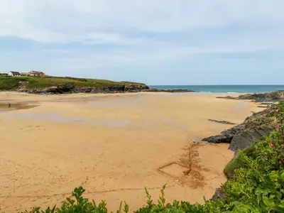 a beach with a heart drawn in the sand at Pepper Cove in Padstow