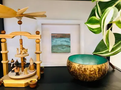 a room with a bowl and a table with a plant at The Cuckoo's Retreat - Luxurious home with private garden & jacuzzi in Kenwyn