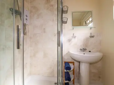 a bathroom with a sink and a shower at Gwanda in Padstow