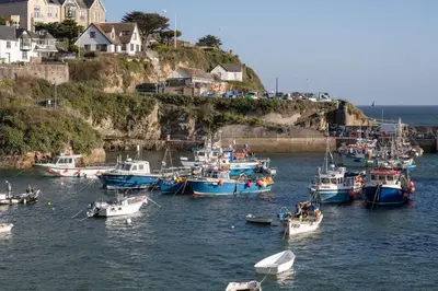 a group of boats in a body of water at Cosy Apartment Parking Central Newquay in Newquay