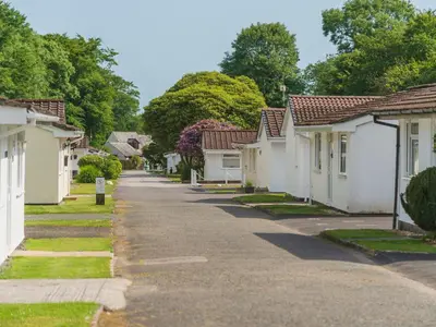 a street of houses in a residential neighbourhood at Chalet Kingfishers Lodge by Interhome in Liskeard
