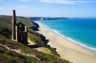 an old building on a hill next to the beach at 1 Bed in Tresillian oc-p30116 in Saint Clement