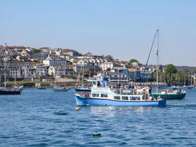 a group of people on a boat in the water at Freesia in Truro