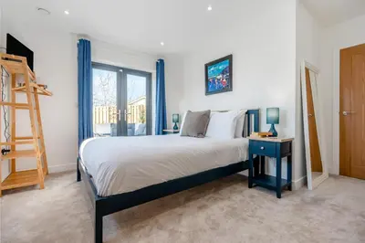 a bedroom with a bed and a ladder and a window at 4 Bed in Porthleven oc-ch30536 in Porthleven