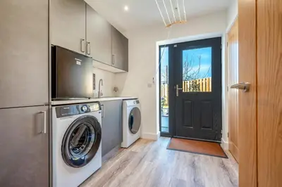a laundry room with a washer and dryer at 4 Bed in Porthleven oc-ch30536 in Porthleven