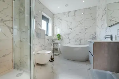 a bathroom with a tub and a toilet and a shower at 4 Bed in Porthleven oc-ch30536 in Porthleven