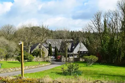 a house in the middle of a road at Hustyn Lodges in Saint Wenn