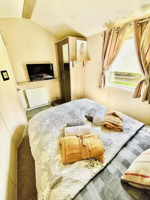 a bedroom with a large bed in a room at Newquay Seaside Lodge Retreat with Hot Tub in Newquay