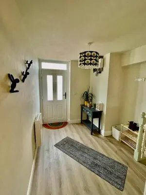 a living room with a door and a rug at Apartment in Constantine in Constantine