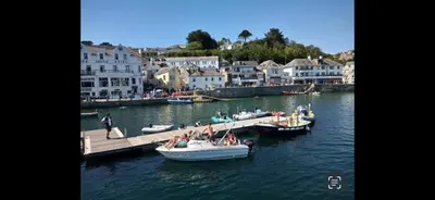 a group of people on boats in the water at Seaview Barns in Budock Water