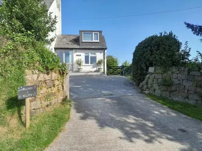 a house with a street sign in front of it at Hillview Haven in Liskeard