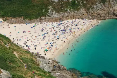 a large group of people on a beach at Cosy Cornish Cottage with Firepit & Parking in Newlyn East