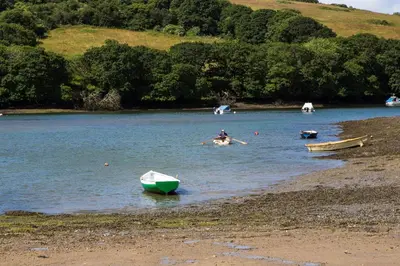 a person rowing a boat in a lake at Riverside in Kea