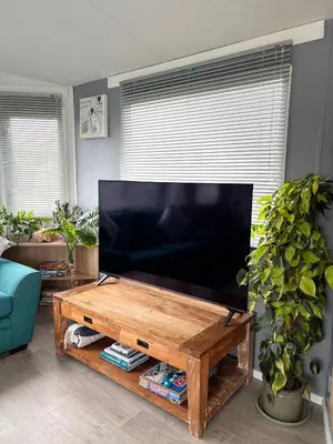 a large flat screen tv in a living room at Stylish Family Friendly 3-Bed Caravan Escape at Seven Bays Park in St Merryn