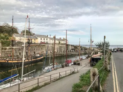 a group of boats docked in a harbor at Swallow Cottage in St Austell