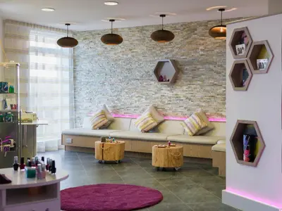 a living room with a couch and a brick wall at Una, Lodge 77 in St Ives