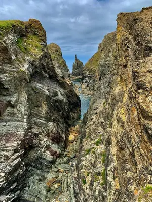 a view of a river between two rocky cliffs at Seaside Escape 2-Bed Caravan at Seven Bays Park in St Merryn