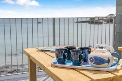 a tray with four cups and a pitcher on a table at 3 Bed in Coverack oc-b31082 in Coverack