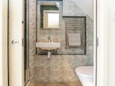 a bathroom with a sink and a mirror at The Cabin at Ropewalk in St. Agnes