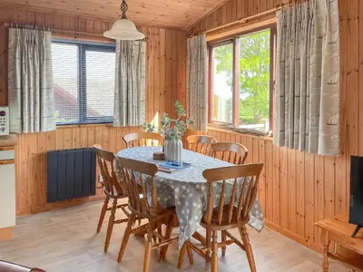 a dining room with a table and chairs at The Hut Hotel in Falmouth