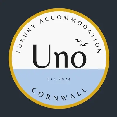 a yellow and white circle with the words uno at Uno Moor Side - 4 Bed, 2 Bath, Garden, sleeps 8 - Parking in Carbis Bay