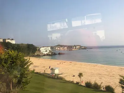 a view of a beach with people on it at Dixies View - 2 bed apartment - Central St Ives in St Ives