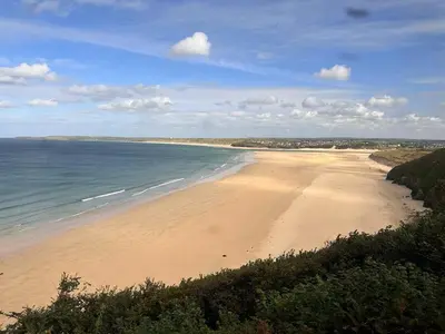 a view of a sandy beach with the ocean at Sea Breeze Escape in Cubert