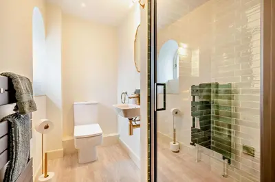 a bathroom with a shower with a toilet and a sink at 4 Bed in Penryn oc-c27969 in Penryn
