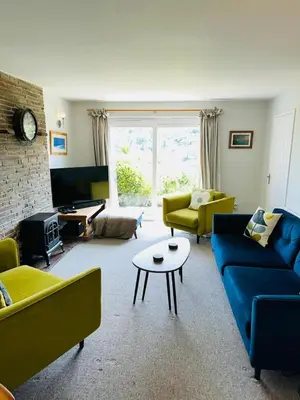a living room with couches and a coffee table at Moogara in Gorran Haven