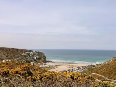 a view of a beach from a hill at The Old Piggery in Truro