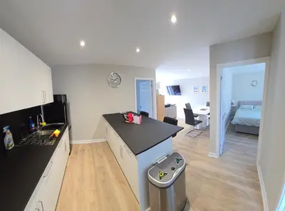 a kitchen with a sink and a counter top at Acklington 2 bedroom property in Menheniot