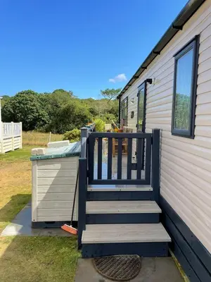 a porch of a tiny house with a deck at Serenity in Saint Erth