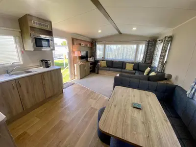 a living room with a couch and a table at The Bolt Hole Polperro in Polperro