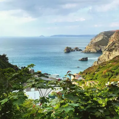 a view of the ocean from a hill at SeaNest, Aggie Home by the sea in St. Agnes