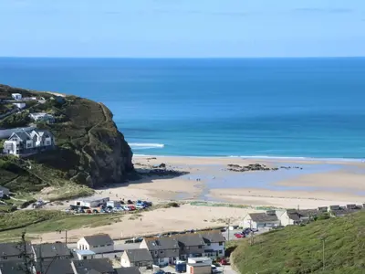 a view of a beach with houses and the ocean at Carn Brea in Redruth