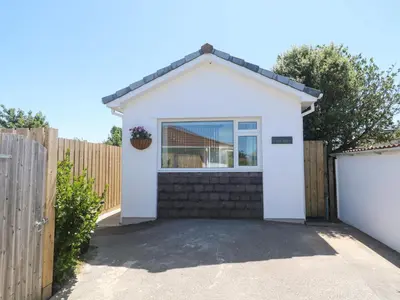 a white house with a fence at Carn Brea in Redruth